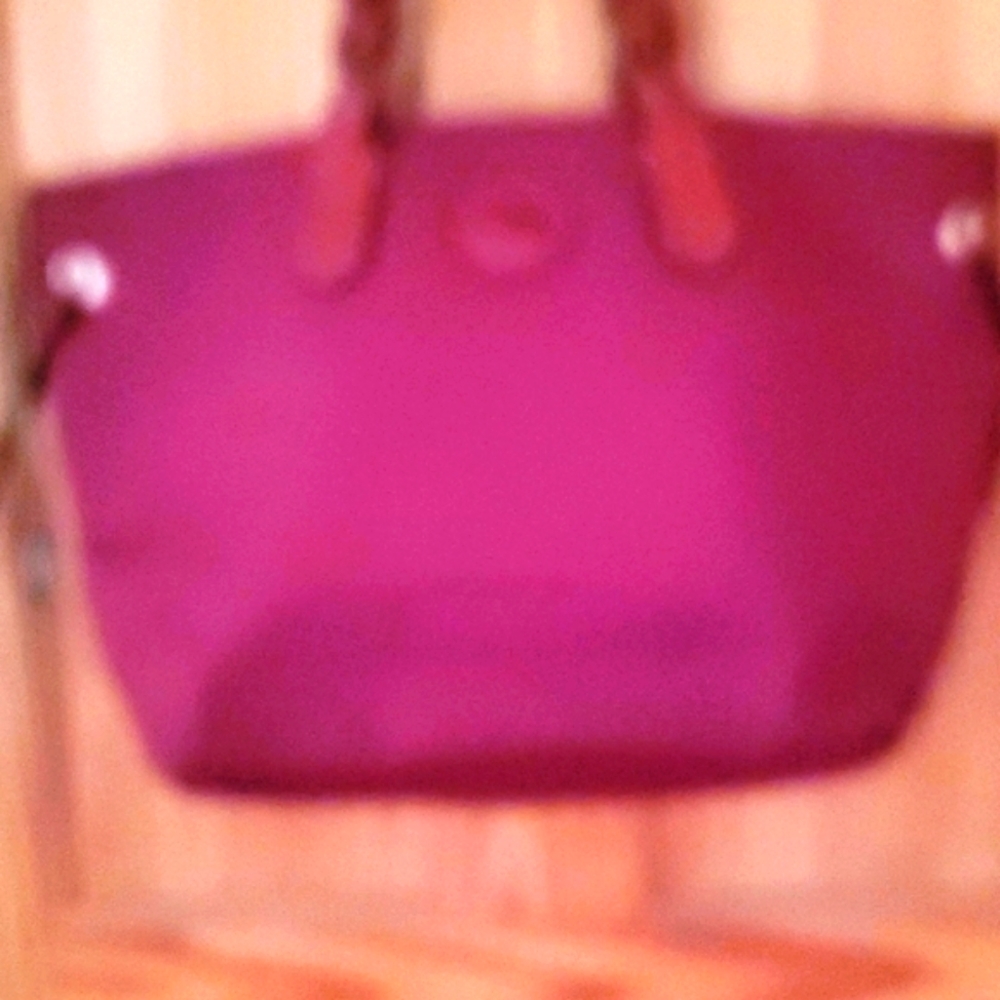 Dooney Bourke burgundy color tote.